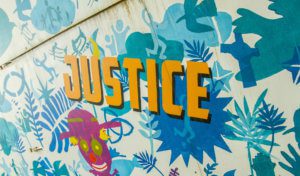 'Justice' part of the St Andrew's mural outside the church